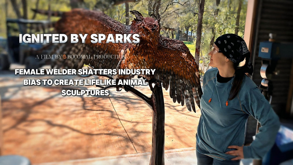 Sarah Stork beside a metal bird sculpture